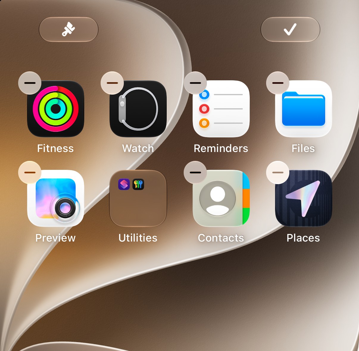 An iPhone Home Screen in edit mode, with a minus sign on each app. Callout 1 circles the button in the top left corner.