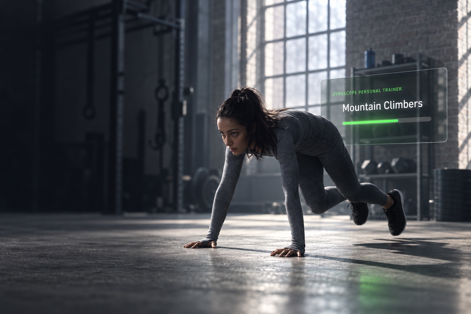 Mountain climbers in a gym with the workout tracked on screen